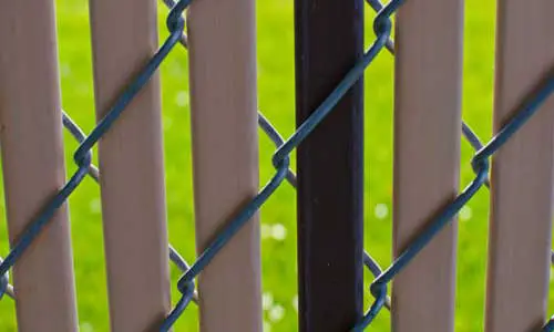 What's the composition of the chain link fence slats